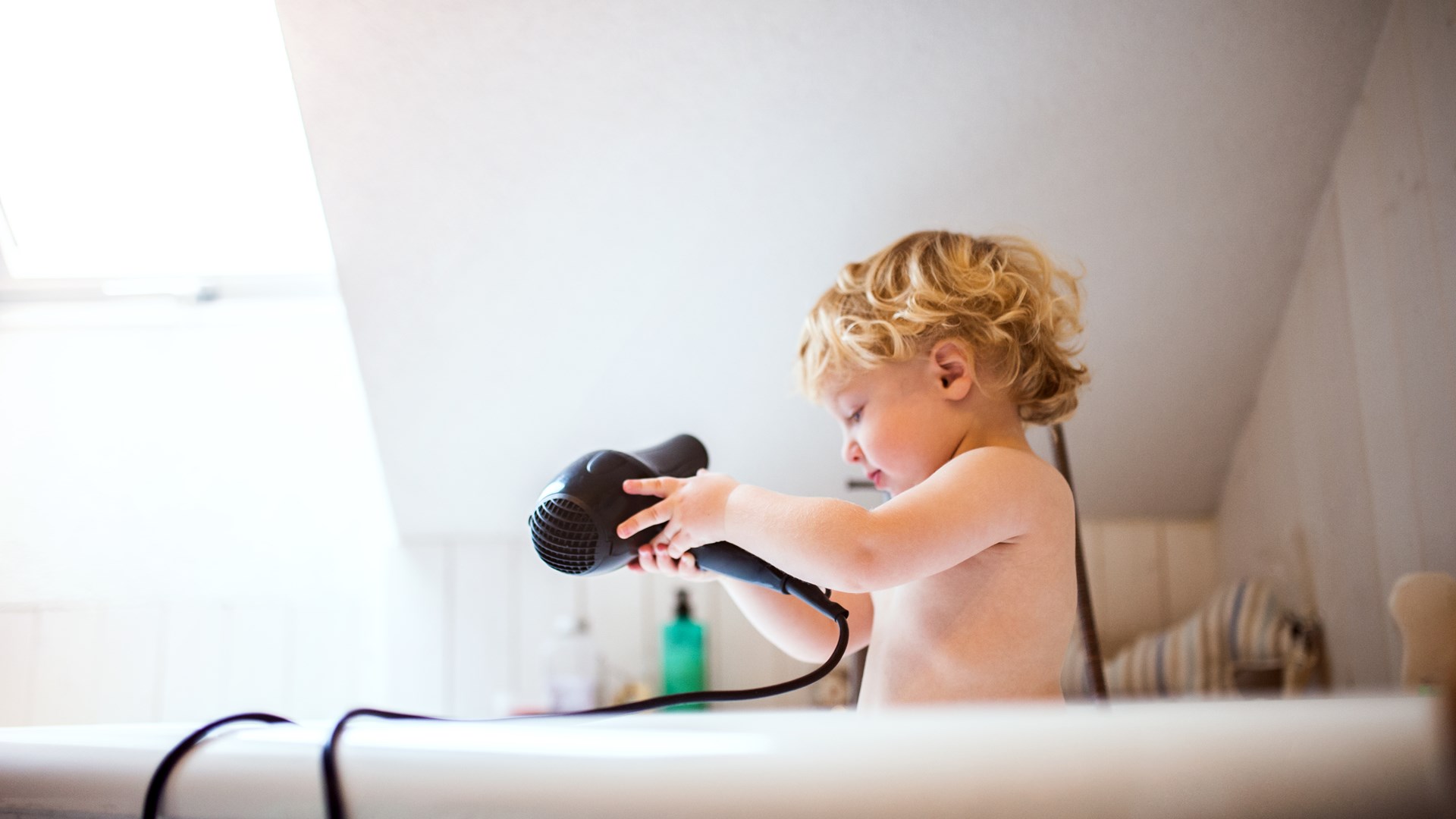 Child in Bath with Hairdryer